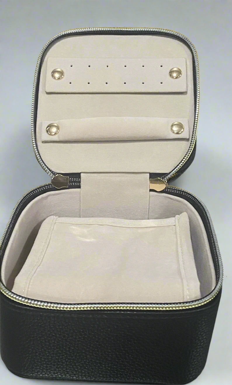 Stay organized in style with this compact travel jewelry case
